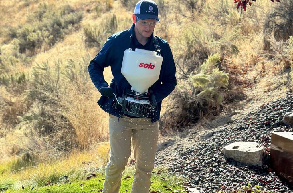 A Habitat Pest & Lawn technician performing pest control in Nampa, ID, showcasing the benefits of our eco-friendly service.