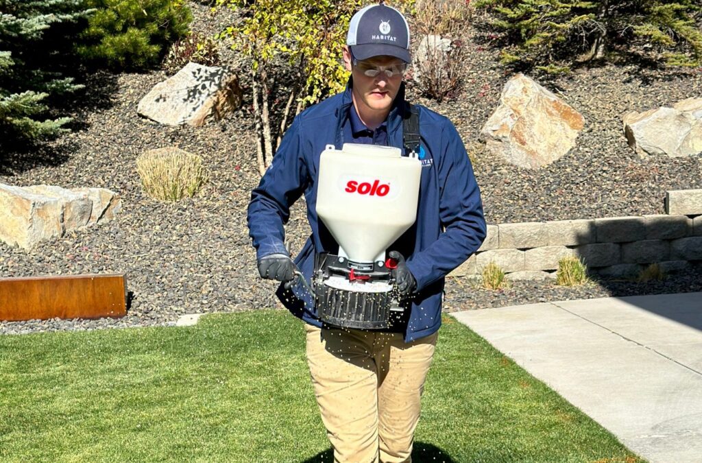 A Habitat Pest & Lawn technician applying pest control solutions in Greenleaf, ID, ensuring effective and eco-friendly treatments.